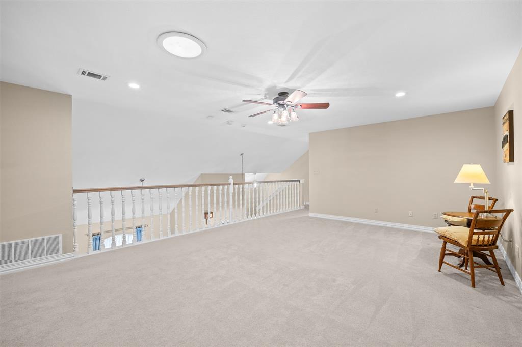 7225 Moss Ridge Road Parker, TX 75098 - Photo 20 of 40 Spacious loft area featuring light-colored carpeting, a ceiling fan, and recessed lighting