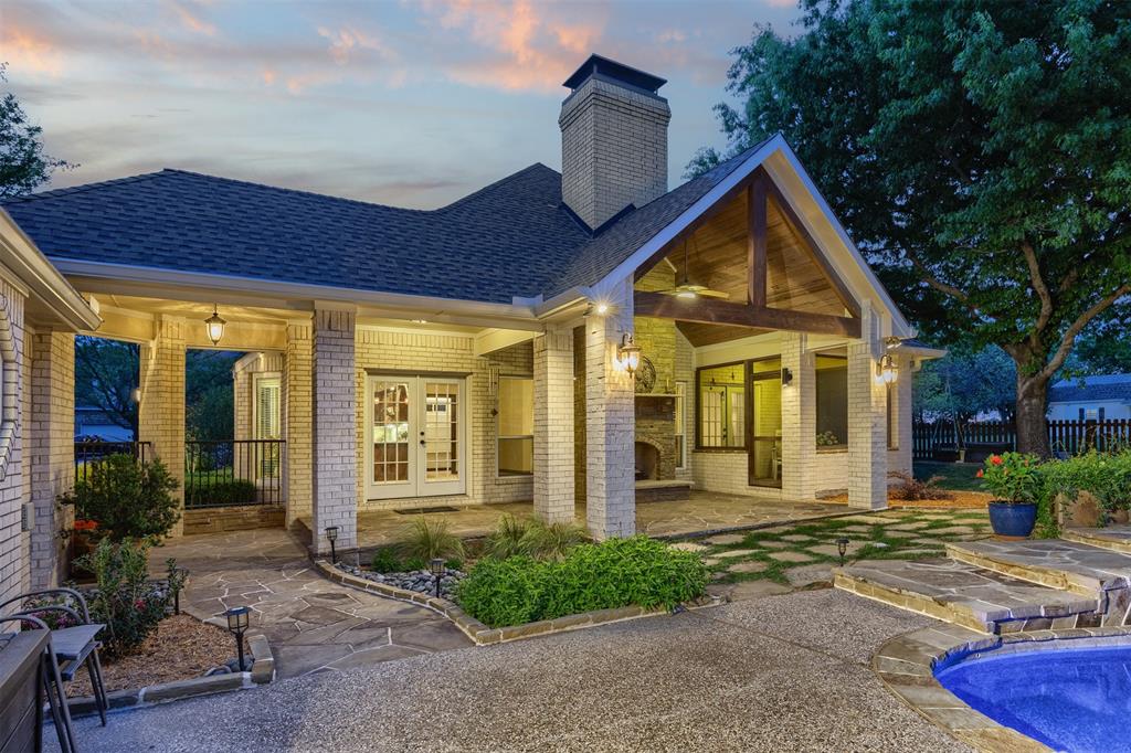 7225 Moss Ridge Road Parker, TX 75098 - Photo 37 of 40 The property features a spacious outdoor area with a swimming pool, a covered patio with exposed wooden beams, and a brick exterior