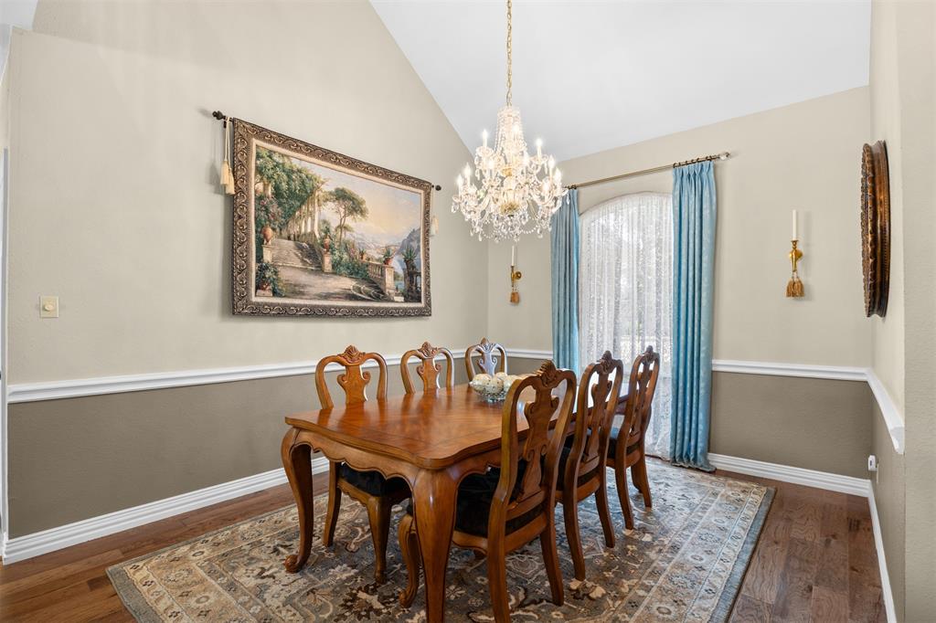 7225 Moss Ridge Road Parker, TX 75098 - Photo 4 of 40 This dining space features hardwood flooring, a vaulted ceiling, and an arched window with light blue drapery