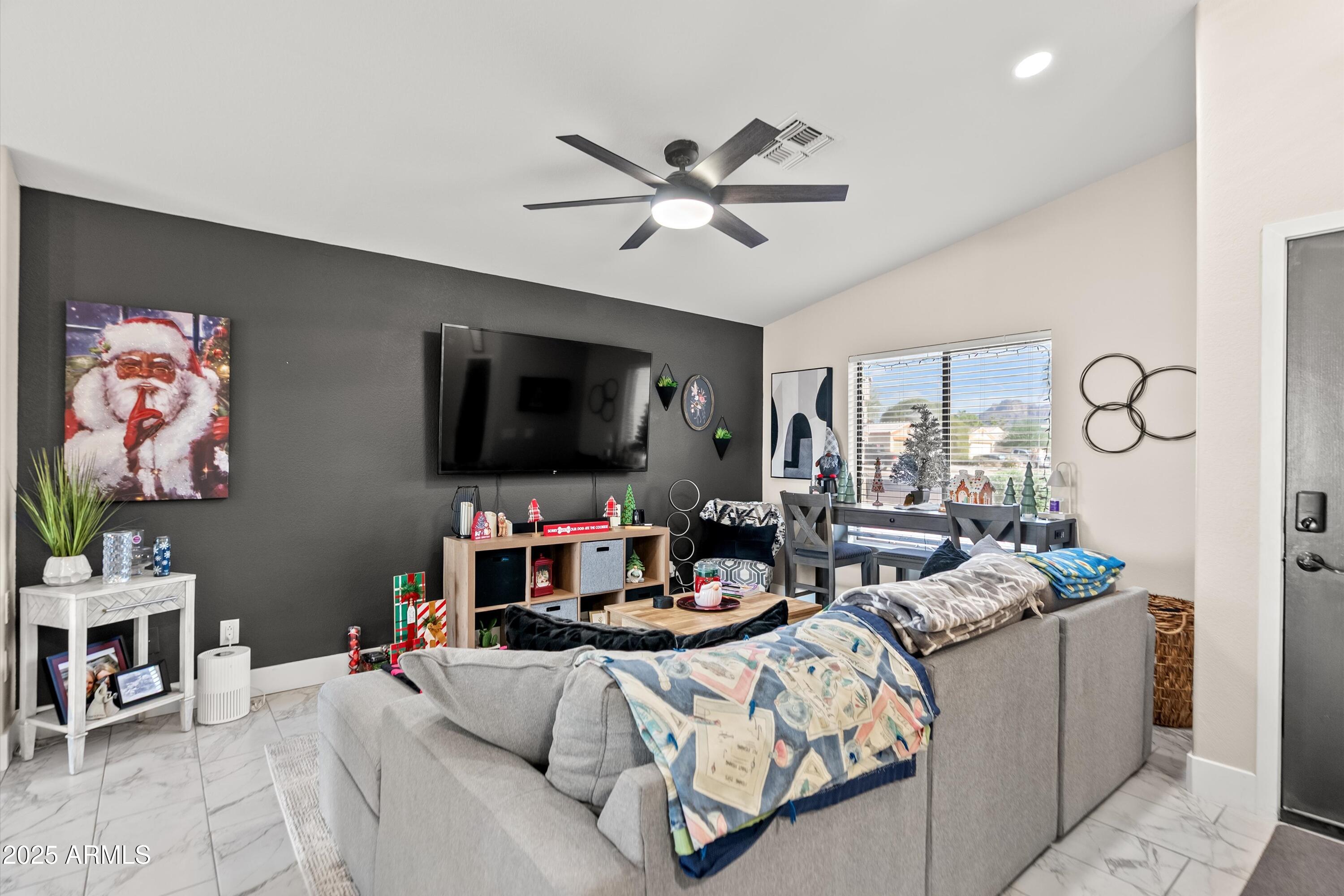 a living room with furniture and a flat screen tv
