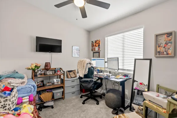 a bathroom with a sink vanity mirror and toilet