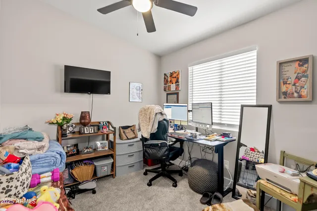 a bathroom with a sink vanity mirror and toilet