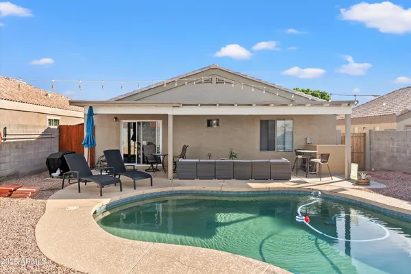 a view of a swimming pool with a patio