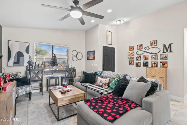 a living room with furniture and a flat screen tv