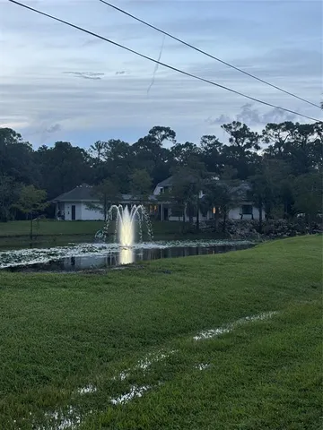 a view of a lake with a big yard