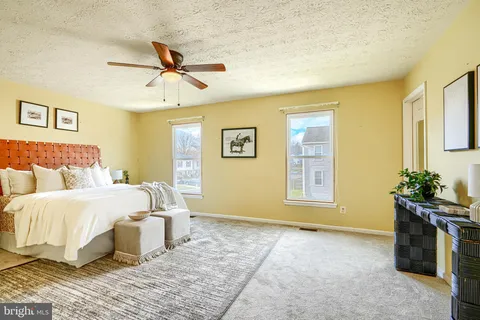 a bed room with a bed and a chandelier