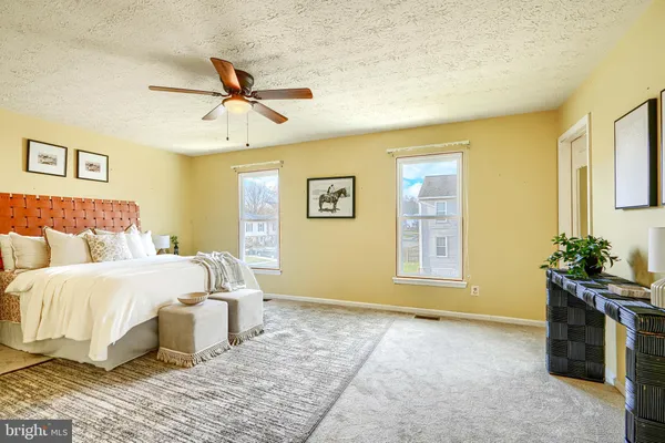 a bed room with a bed and a chandelier