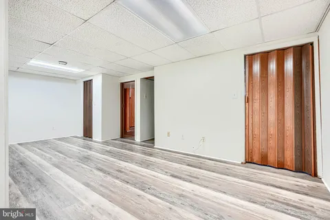 a view of a room with a bed and a window
