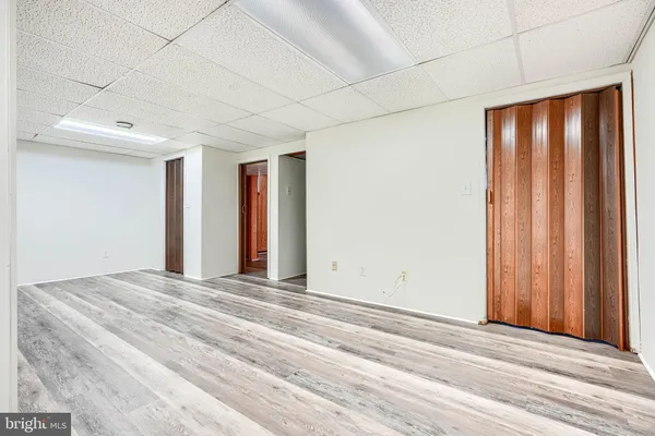 a view of a room with a bed and a window