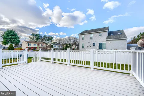 a view of a house with wooden deck