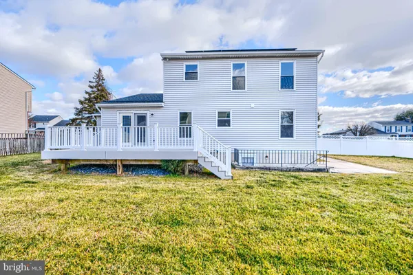 a house with swimming pool in front of it