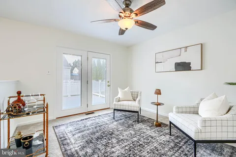 a living room with furniture and a rug