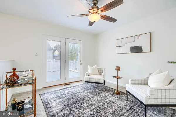 a living room with furniture and a rug