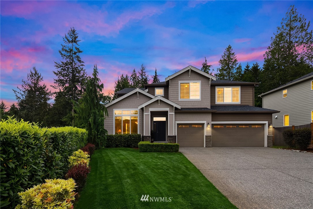 22230 34th Avenue Southeast Bothell, WA 98021 - Photo 1 of 1 a front view of a house with a yard and potted plants