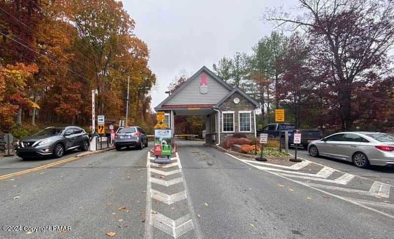 Lot -990 Lot -990 Canterbury Road Bushkill, PA 18324 - Photo 5 of 10 a view of a cars park in front of a house