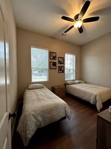 a bedroom with bed and window
