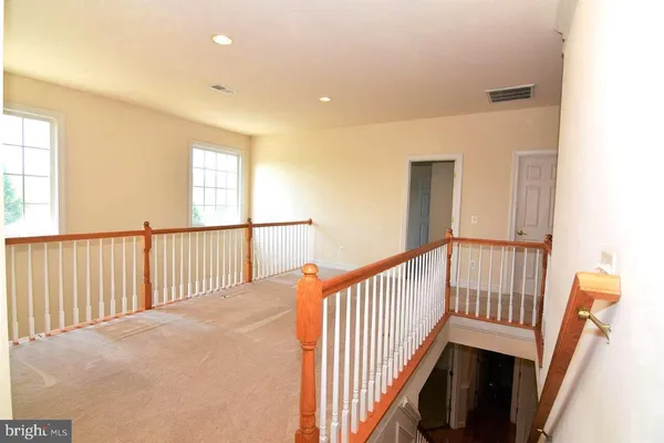 a view of staircase with rug floor