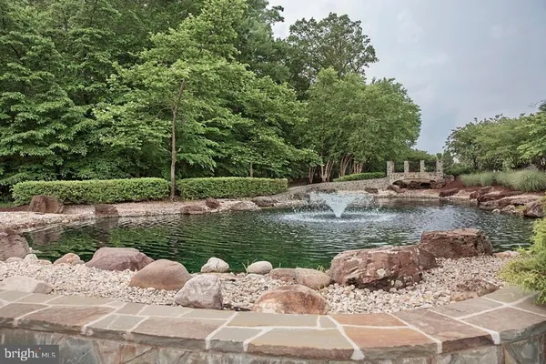 a view of a lake with huge green field