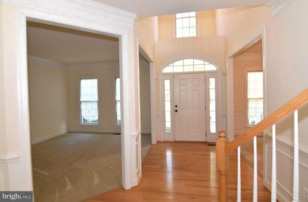 4619 Beaufont Spring Court Woodbridge, VA 22192 - Photo 4 of 42 a view of a bathroom with wooden floor and window
