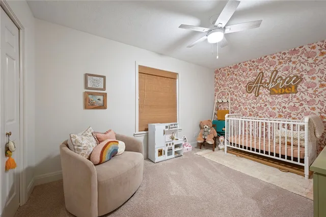 a bedroom with furniture and a window