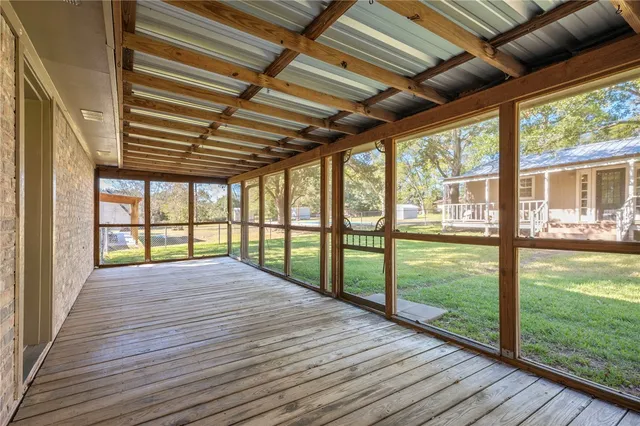 a view of balcony with wooden floor