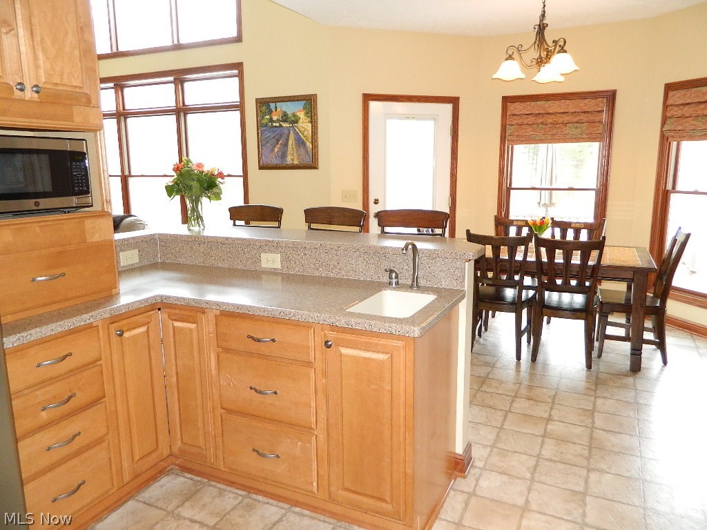 12395 Falcon Ridge Road Chesterland, OH 44026 - Photo 9 of 35 This View Features the Prep Area with Prep Sink and Breakfast Bar