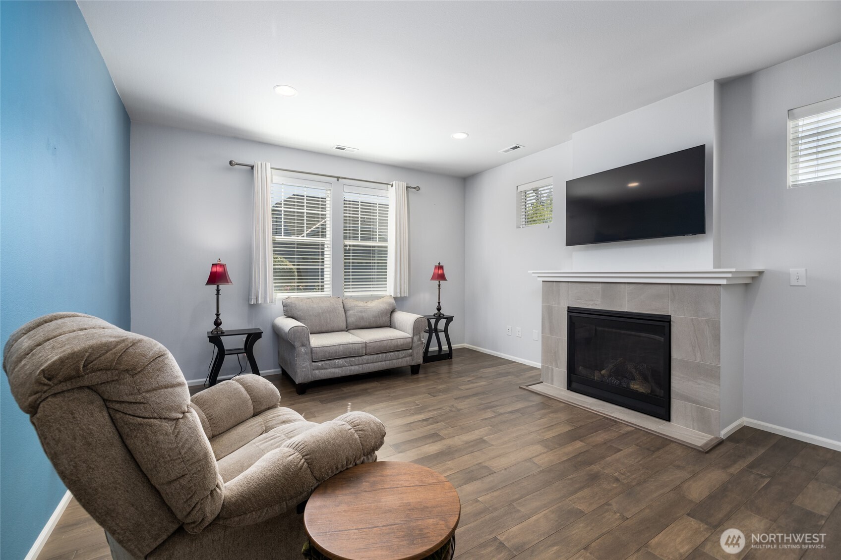 232 Sinclair Alley Mount Vernon, WA 98274 - Photo 5 of 33 a living room with furniture a flat screen tv and a fireplace