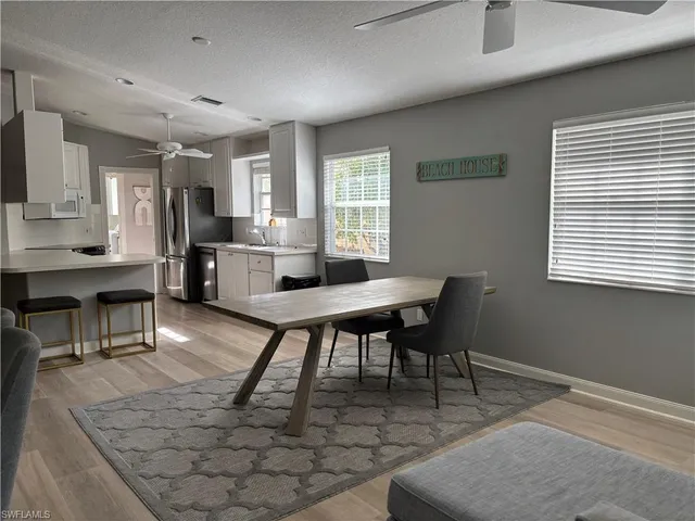 a workspace with furniture and a potted plant