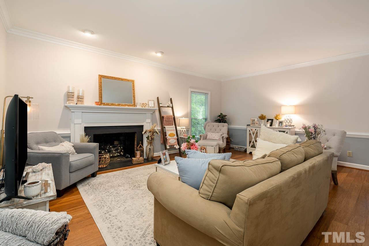 738 Weathergreen Drive Raleigh, NC 27615 - Photo 11 of 31 a living room with furniture and a fireplace