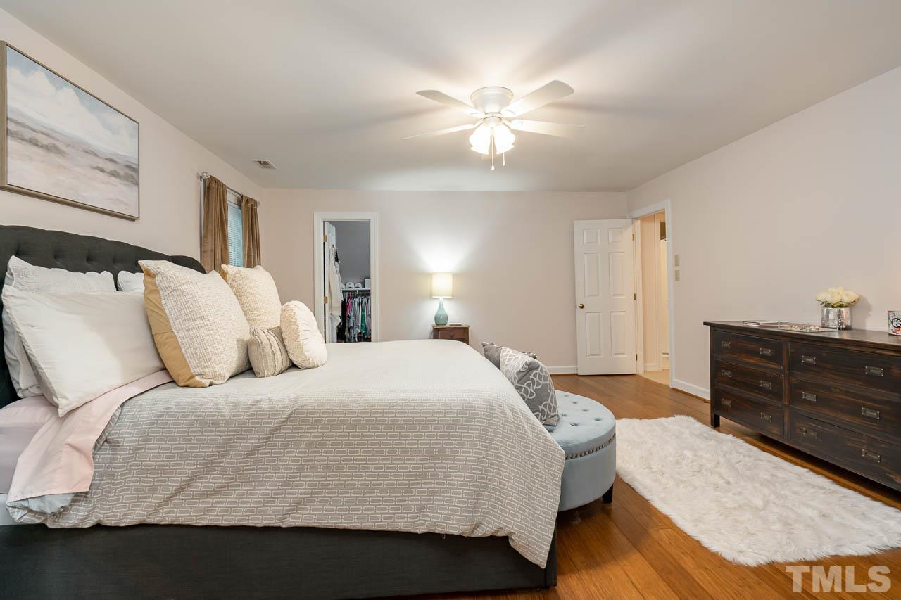 738 Weathergreen Drive Raleigh, NC 27615 - Photo 19 of 31 a bedroom with a bed and wooden floor