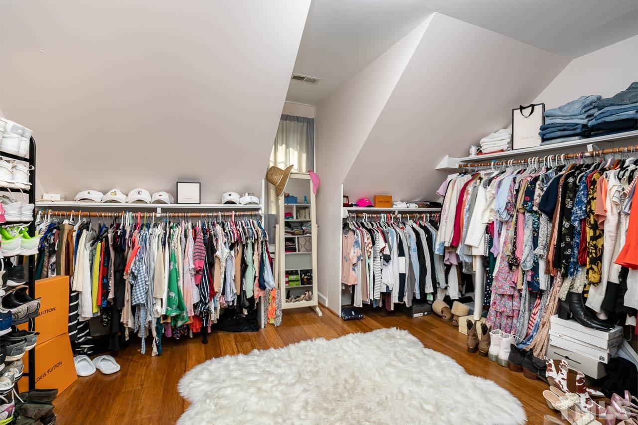 738 Weathergreen Drive Raleigh, NC 27615 - Photo 20 of 31 a view of walk in closet with clothes