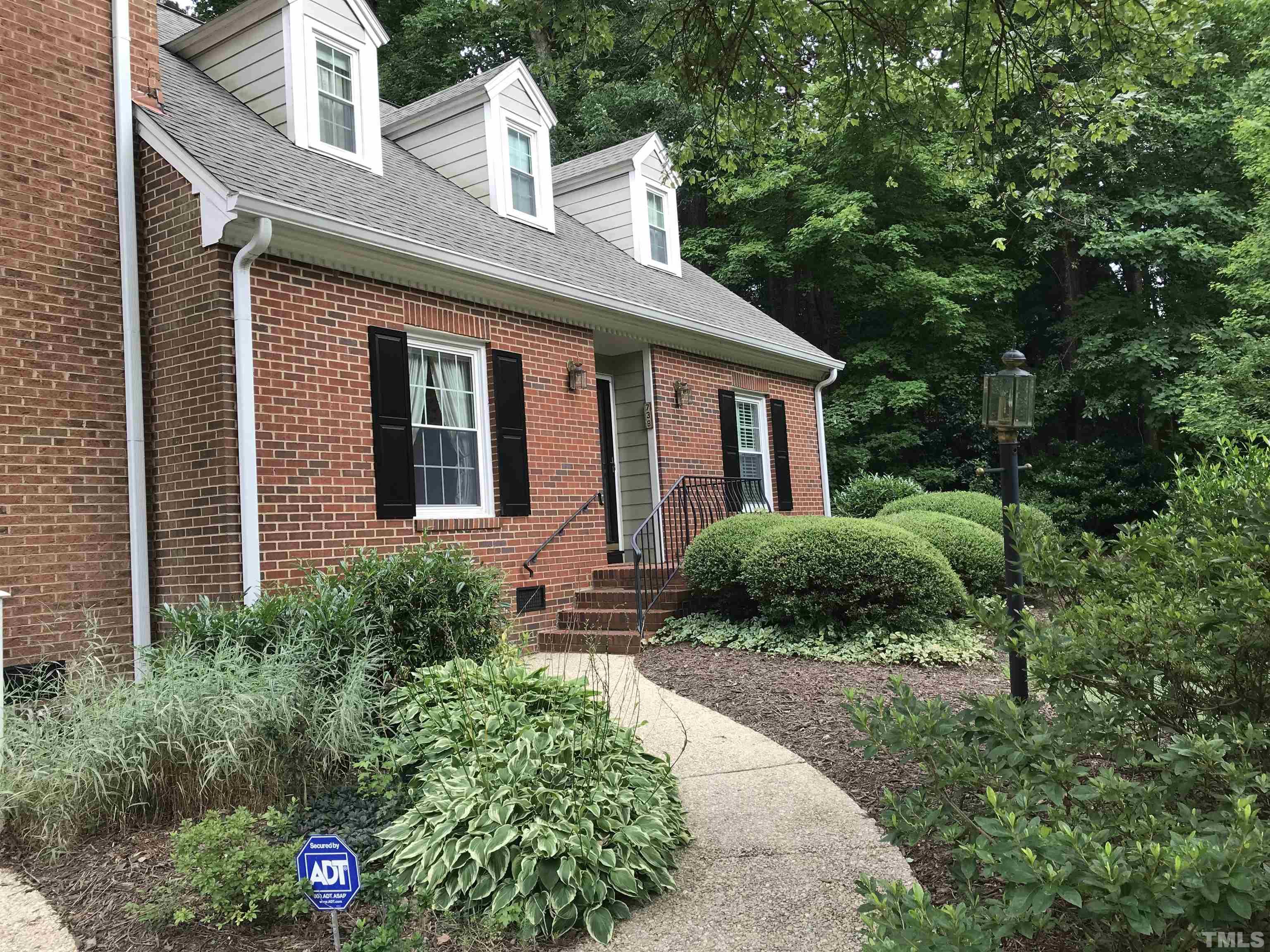 738 Weathergreen Drive Raleigh, NC 27615 - Photo 2 of 31 a front view of a house with garden