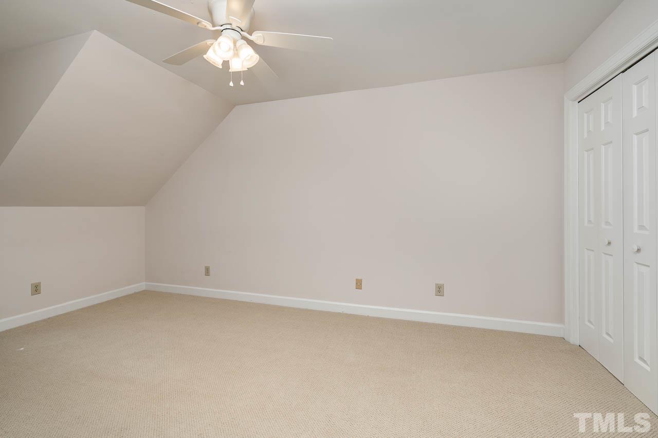 738 Weathergreen Drive Raleigh, NC 27615 - Photo 23 of 31 an empty room with a fan & a ceiling fan