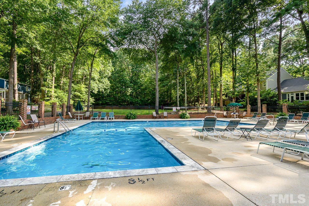738 Weathergreen Drive Raleigh, NC 27615 - Photo 28 of 31 a view of a swimming pool with a patio