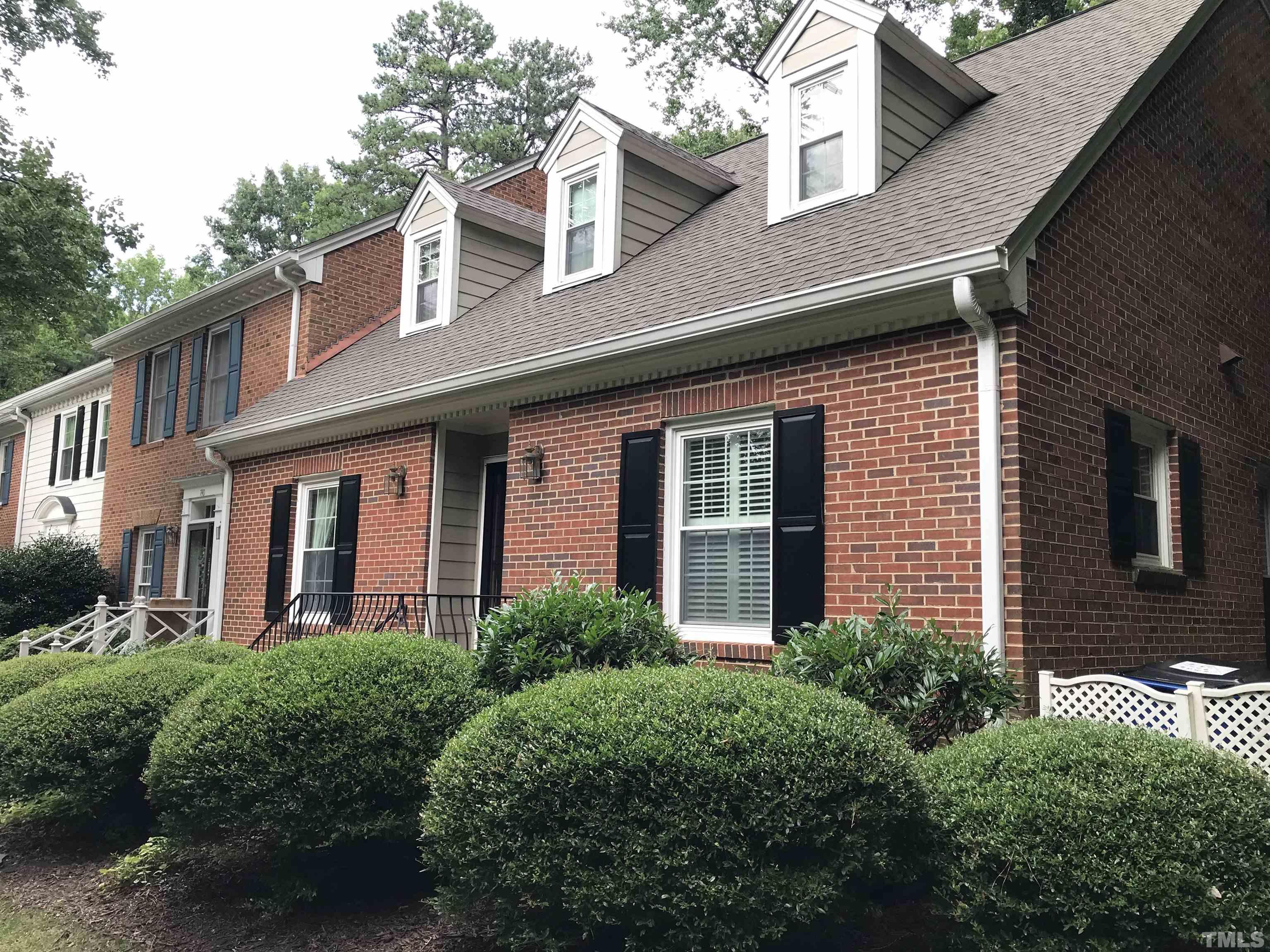 738 Weathergreen Drive Raleigh, NC 27615 - Photo 3 of 31 a front view of a brick house with a yard