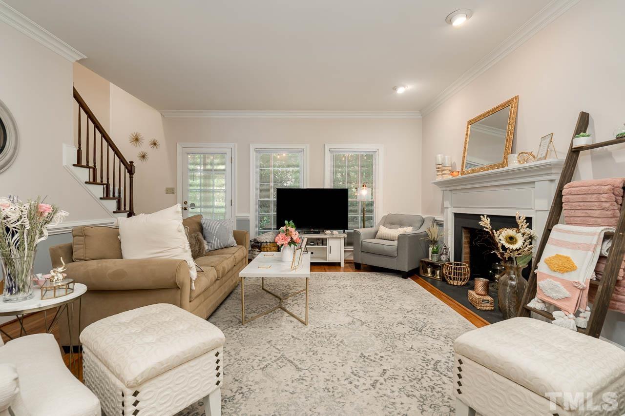 738 Weathergreen Drive Raleigh, NC 27615 - Photo 10 of 31 a living room with furniture and a fireplace