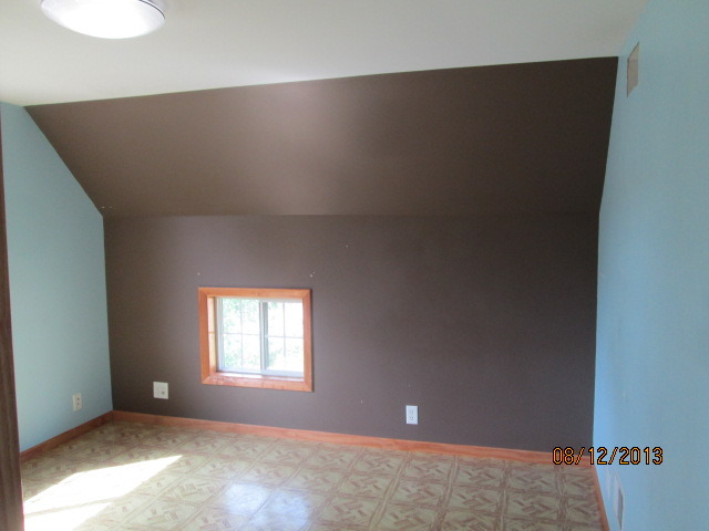 113 Garfield Road Harvard, IL 60033 - Photo 10 of 11 a view of an empty room with a window