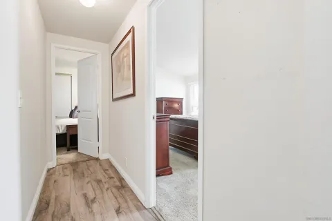 a bedroom with a bed and a potted plant