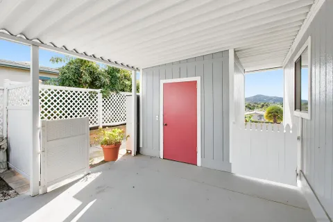 a swimming pool with outdoor seating and yard