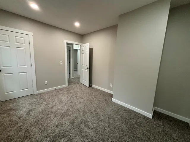 an empty room with closet area