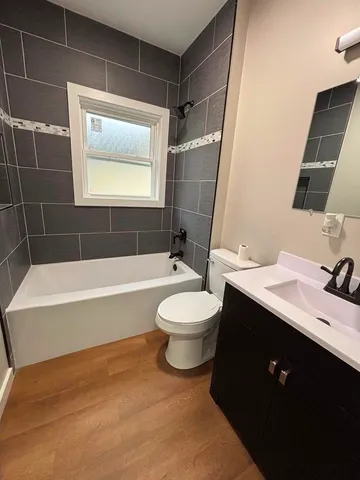 a bathroom with a toilet a sink and bathtub