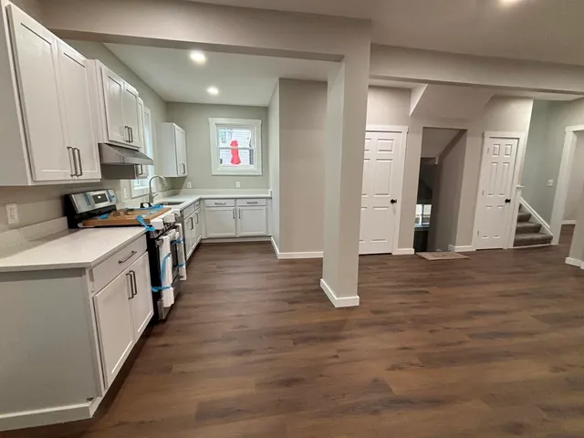 a kitchen with counter top space and cabinets