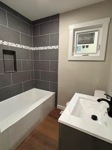 a bathroom with a sink and a bathtub