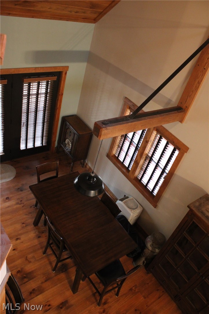 3989 Court Road Wakeman, OH 44889 - Photo 5 of 36 Dining area with dark wood-style flooring and a high wooden ceiling