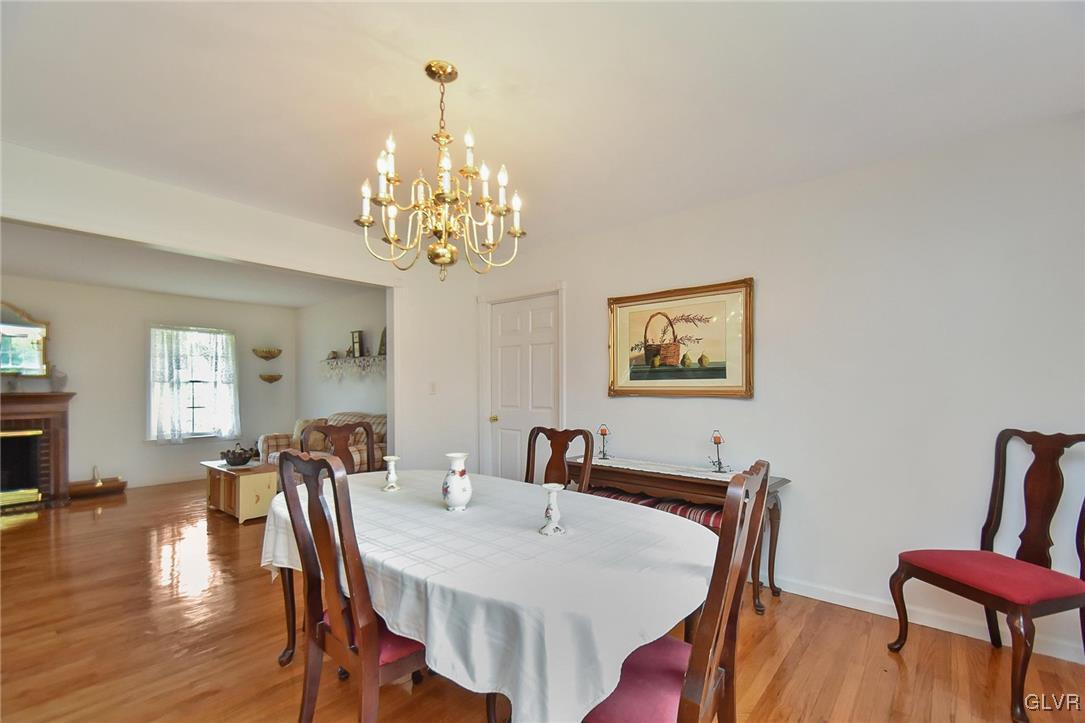 105 Hahn Road Stroudsburg, PA 18360 - Photo 11 of 45 a view of a dining room with furniture wooden floor and a chandelier