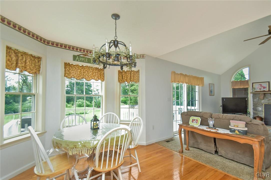 105 Hahn Road Stroudsburg, PA 18360 - Photo 15 of 45 a view of a dining room with furniture wooden floor and chandelier