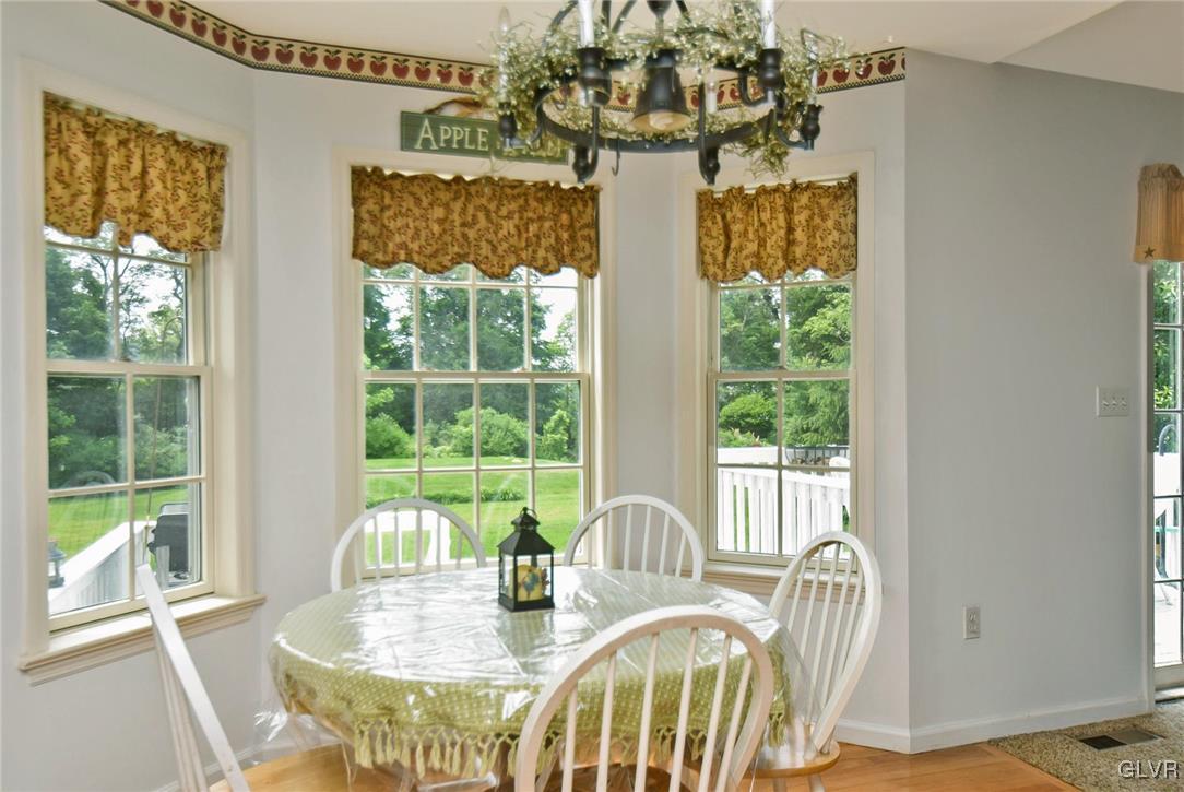 105 Hahn Road Stroudsburg, PA 18360 - Photo 16 of 45 a view of a dining room with furniture a chandelier and wooden floor