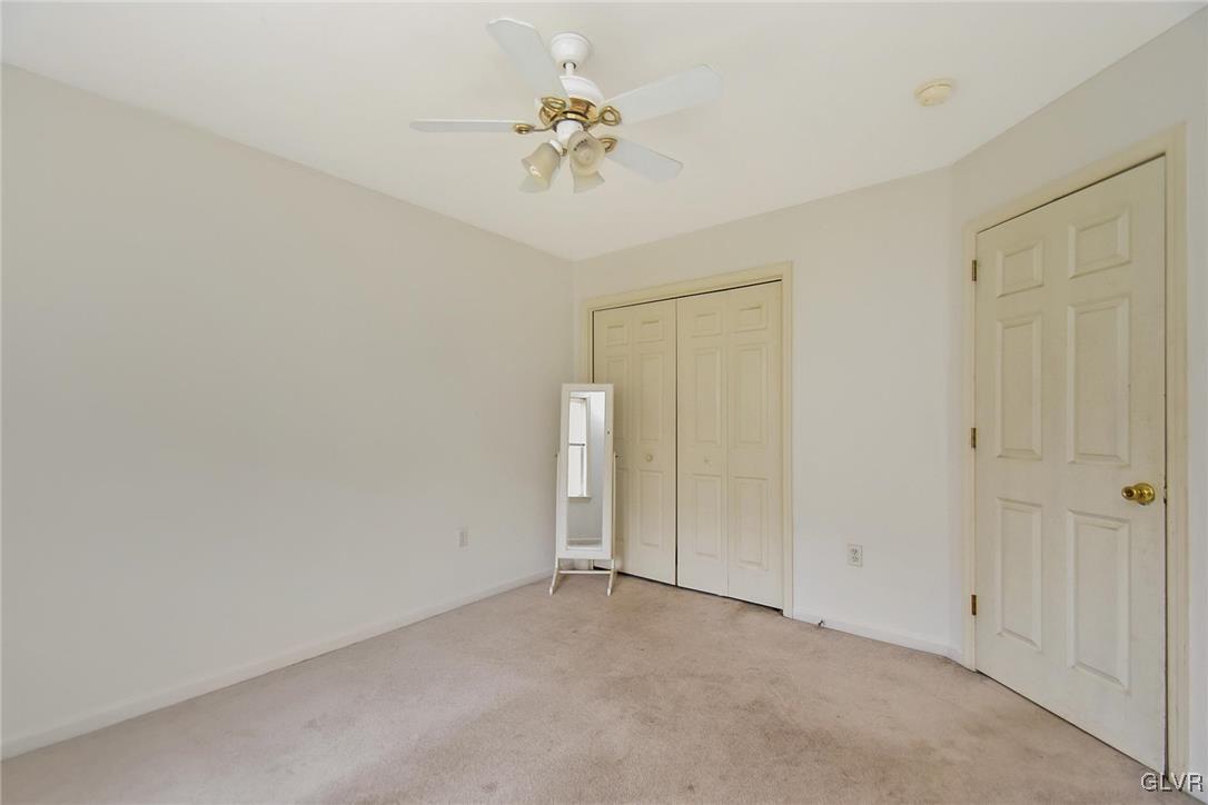 105 Hahn Road Stroudsburg, PA 18360 - Photo 29 of 45 wooden floor in an empty room with a chandelier fan