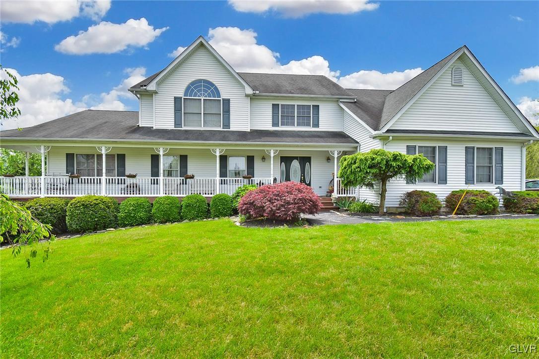 105 Hahn Road Stroudsburg, PA 18360 - Photo 3 of 45 a front view of a house with a yard and potted plants