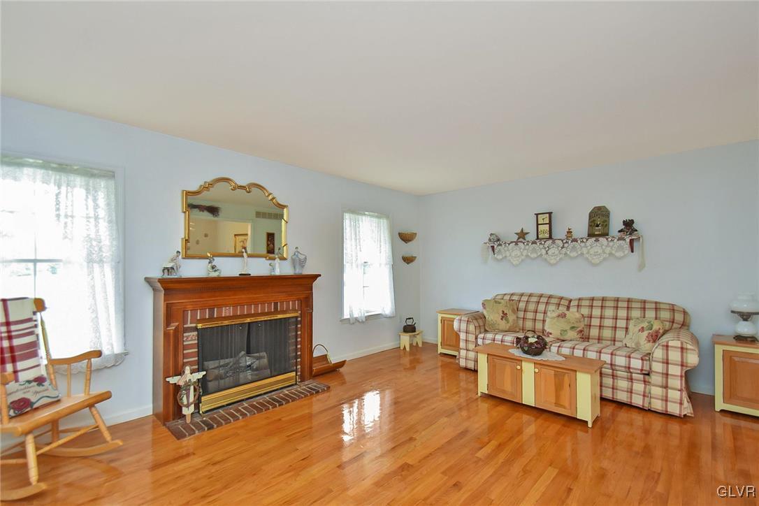 105 Hahn Road Stroudsburg, PA 18360 - Photo 9 of 45 a living room with furniture and a fireplace
